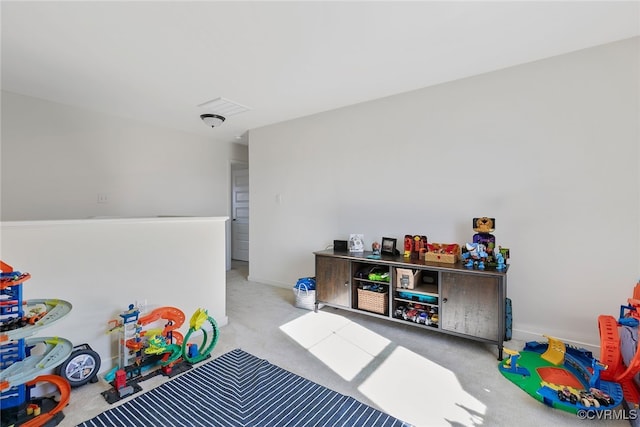 game room with visible vents and carpet