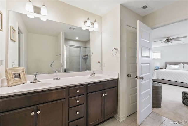 bathroom featuring a sink, visible vents, and a shower stall