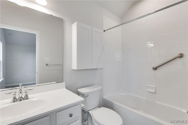 bathroom with shower / bath combination, toilet, and vanity