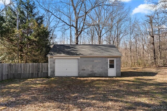 garage with fence