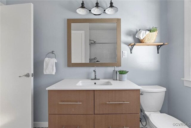 full bathroom with a shower, toilet, and vanity