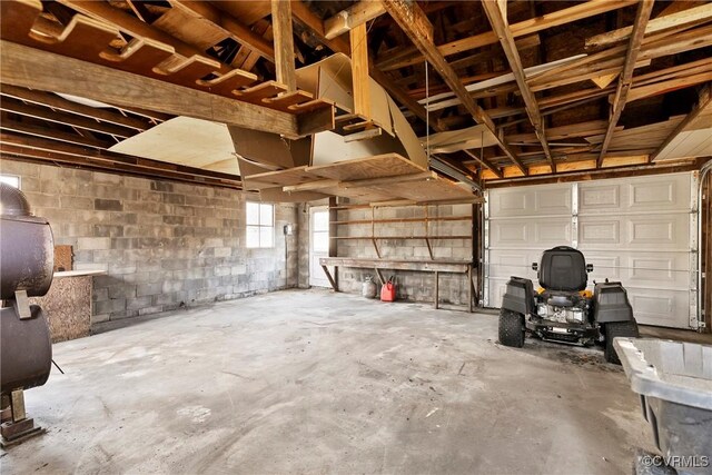 garage with concrete block wall