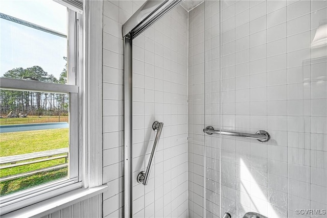 bathroom with tiled shower