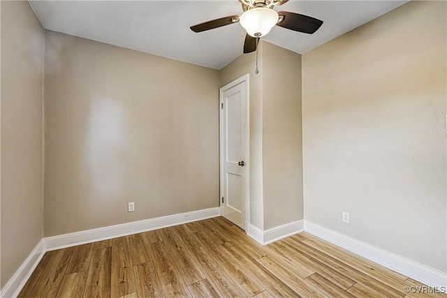 unfurnished room with light wood finished floors, ceiling fan, and baseboards