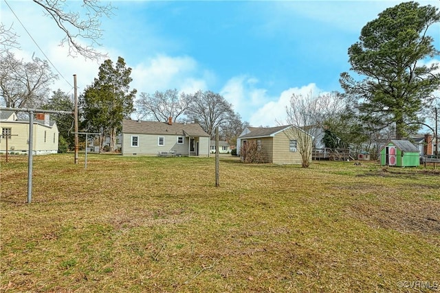 view of yard with an outbuilding and a storage unit