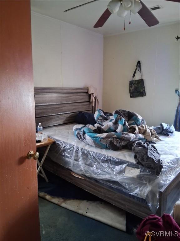 bedroom with a ceiling fan and visible vents