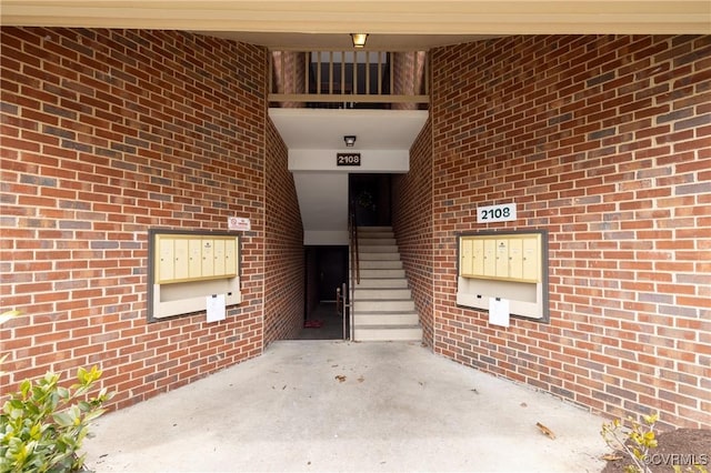 property entrance featuring brick siding