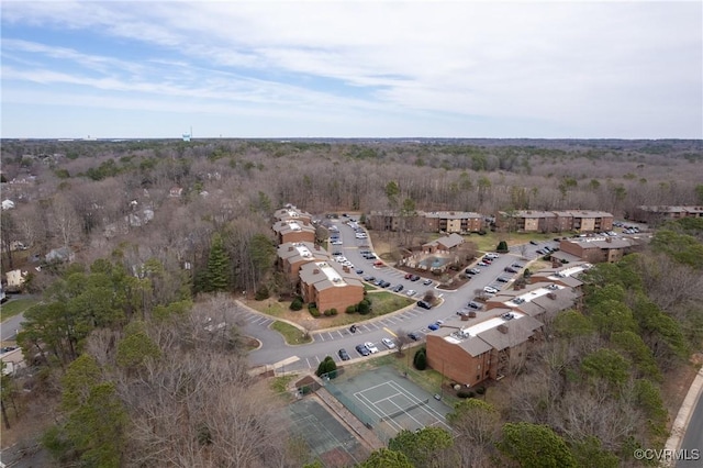 drone / aerial view featuring a view of trees