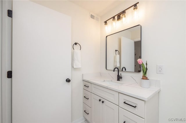 bathroom with visible vents and vanity