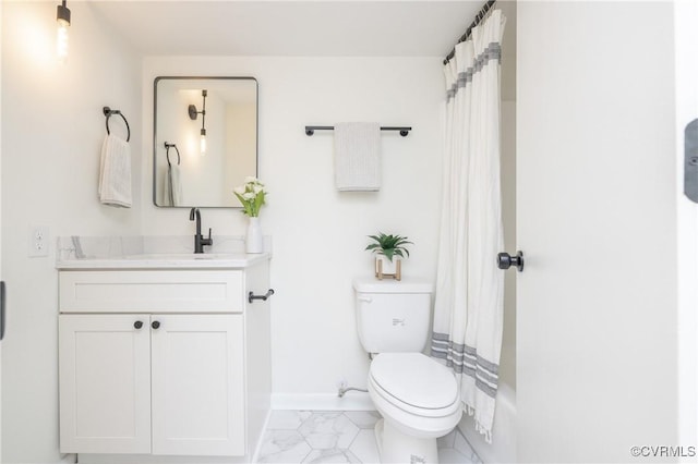 full bath with baseboards, toilet, marble finish floor, and vanity