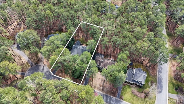 bird's eye view featuring a forest view