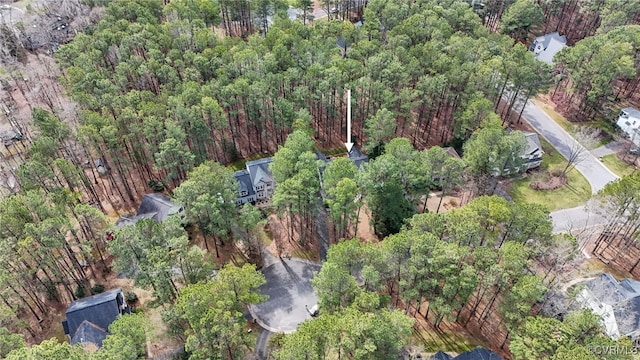 drone / aerial view featuring a forest view