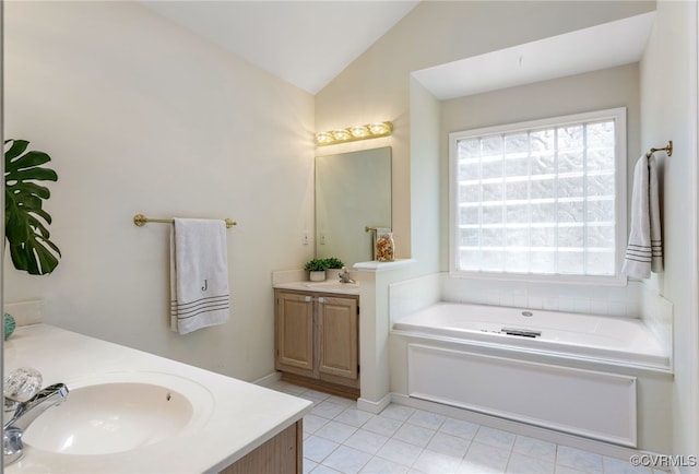 full bathroom with a sink, lofted ceiling, two vanities, and a bath