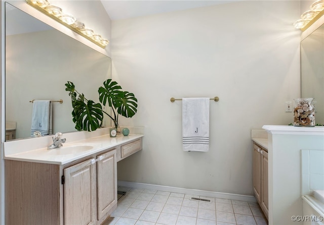 full bath with vanity, tile patterned floors, baseboards, and visible vents