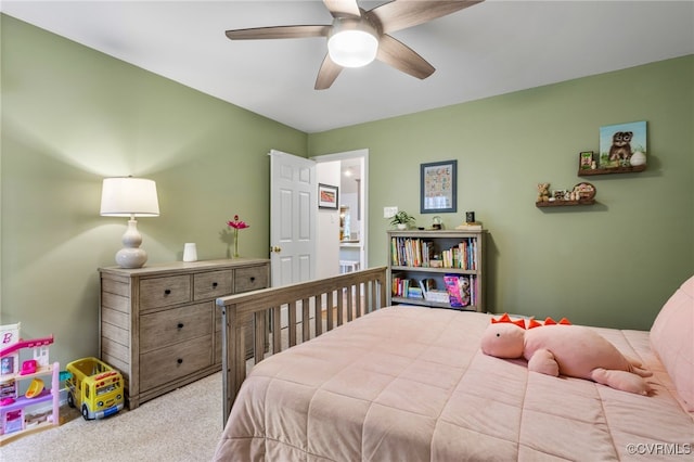 carpeted bedroom with a ceiling fan