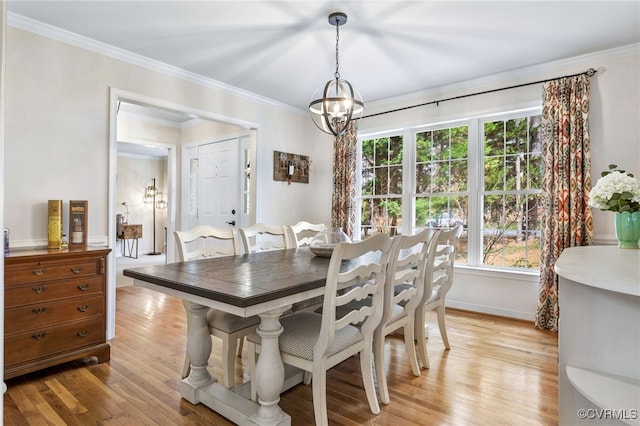 dining room with baseboards, a notable chandelier, light wood-style flooring, and crown molding