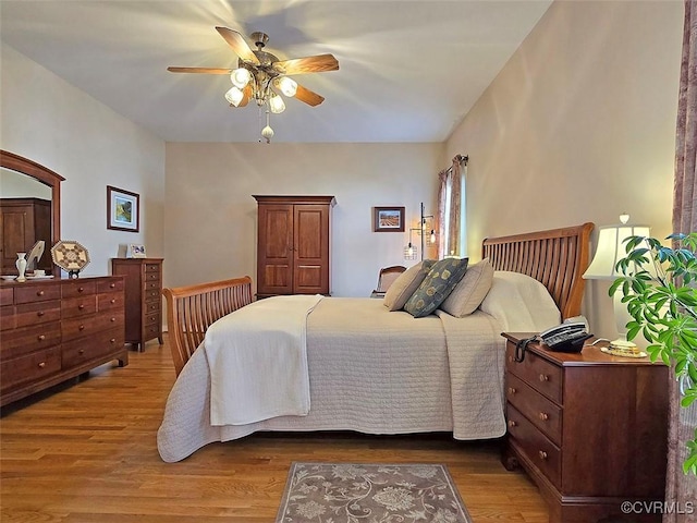 bedroom with wood finished floors and a ceiling fan