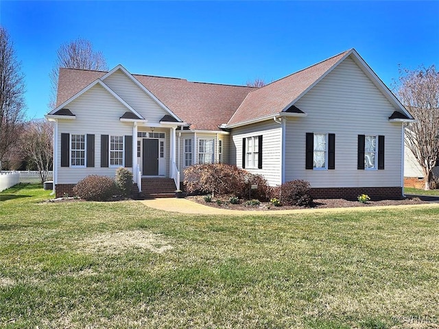 view of front facade with crawl space, a front yard, and roof with shingles