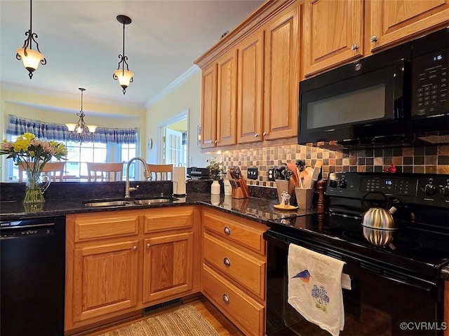 kitchen with visible vents, backsplash, dark stone counters, black appliances, and a sink