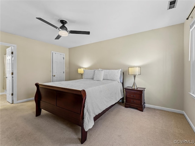 bedroom featuring visible vents, light carpet, baseboards, and ceiling fan