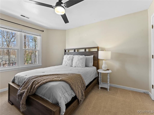 bedroom featuring visible vents, ceiling fan, baseboards, and carpet floors