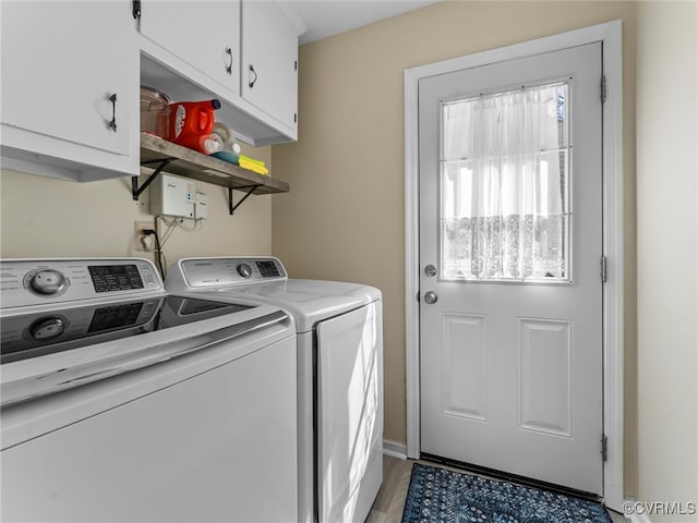 laundry area with cabinet space and washer and clothes dryer