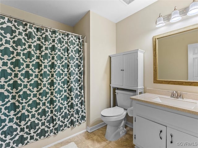 full bath with vanity, tile patterned floors, toilet, and baseboards