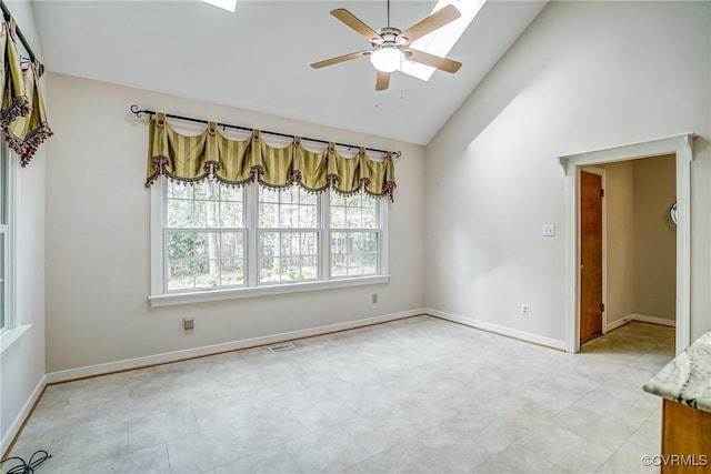 empty room featuring visible vents, a ceiling fan, baseboards, and high vaulted ceiling