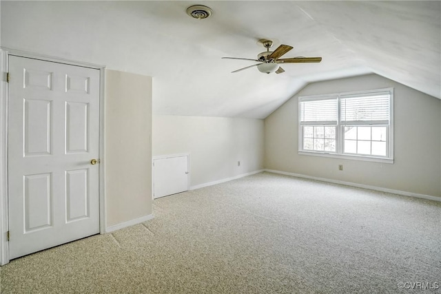 bonus room featuring visible vents, ceiling fan, baseboards, carpet floors, and vaulted ceiling