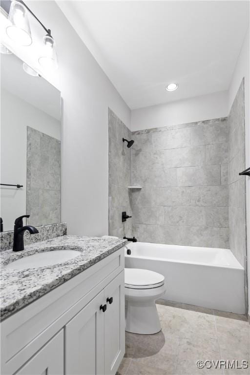 full bathroom with bathing tub / shower combination, toilet, and vanity