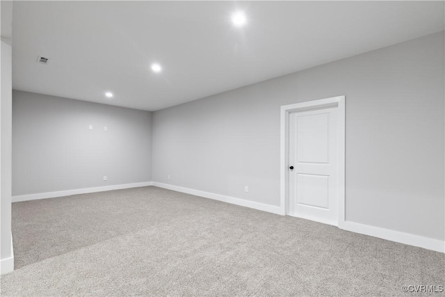 unfurnished room with visible vents, recessed lighting, baseboards, and carpet floors