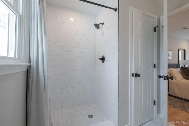 bathroom with ensuite bath, visible vents, and a stall shower