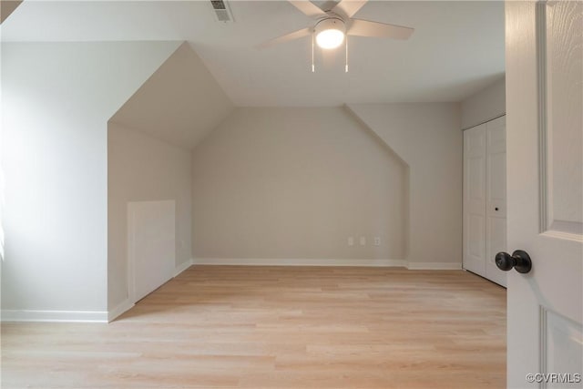 bonus room with visible vents, baseboards, a ceiling fan, and light wood finished floors