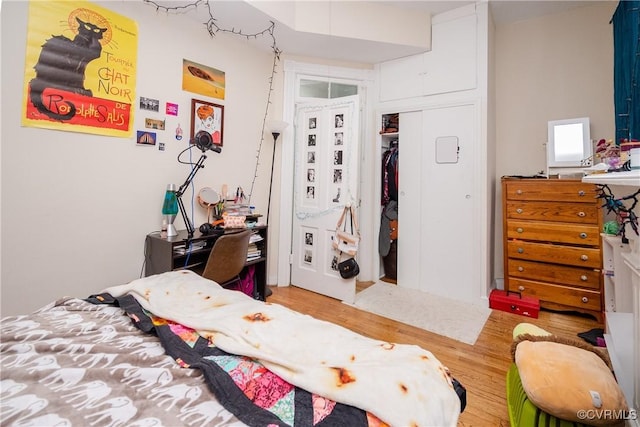 bedroom featuring a closet and wood finished floors