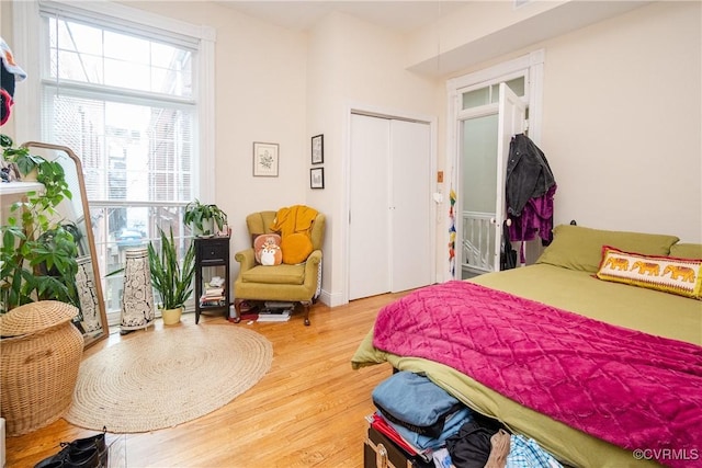 bedroom featuring a closet and wood finished floors