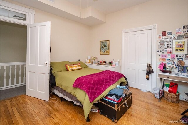 bedroom with wood finished floors