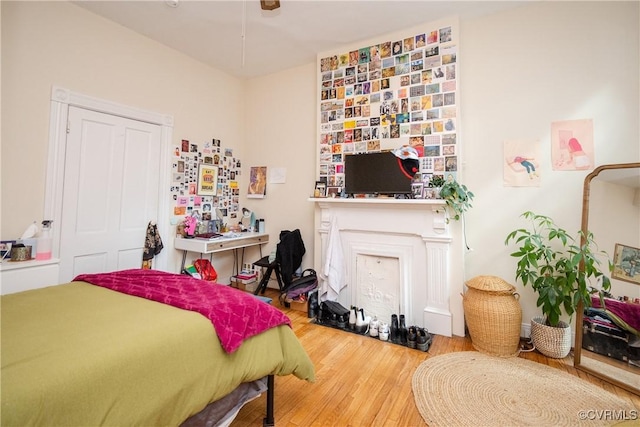 bedroom with wood finished floors