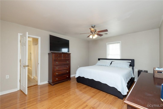 bedroom featuring baseboards, light wood-style floors, and a ceiling fan