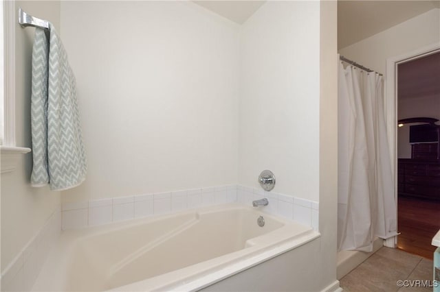 full bath featuring tile patterned floors, a shower with shower curtain, and a bath