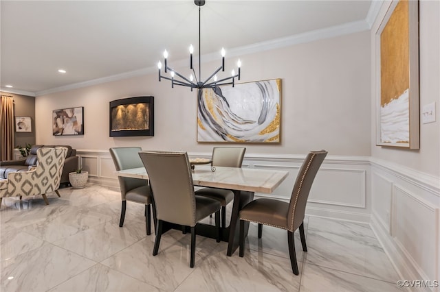 dining room featuring light marble finish flooring, a decorative wall, a chandelier, crown molding, and recessed lighting