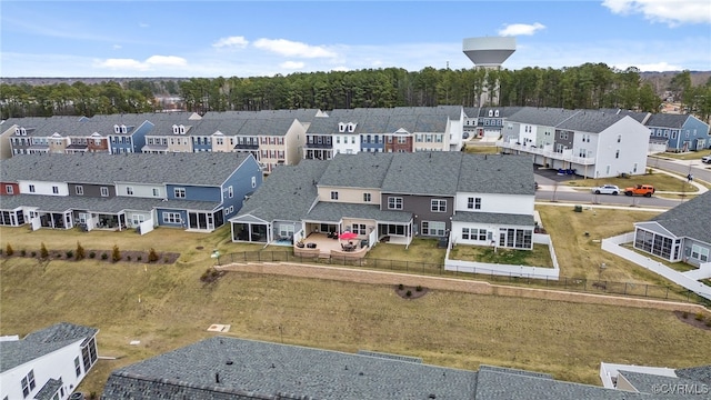 birds eye view of property with a residential view