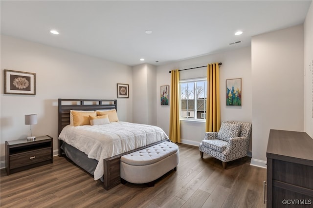 bedroom featuring visible vents, recessed lighting, dark wood-type flooring, and baseboards