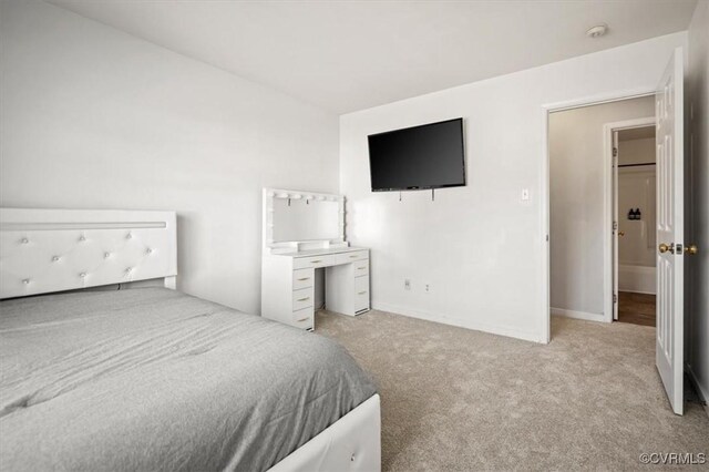 carpeted bedroom with baseboards