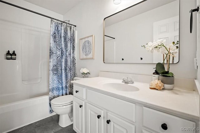 full bath with tile patterned floors, shower / bath combo with shower curtain, toilet, and vanity