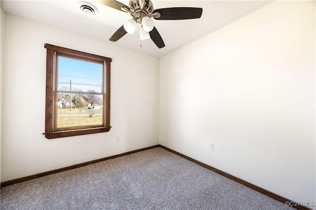 unfurnished room with visible vents, baseboards, ceiling fan, and carpet flooring