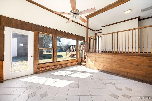 unfurnished sunroom with visible vents and ceiling fan