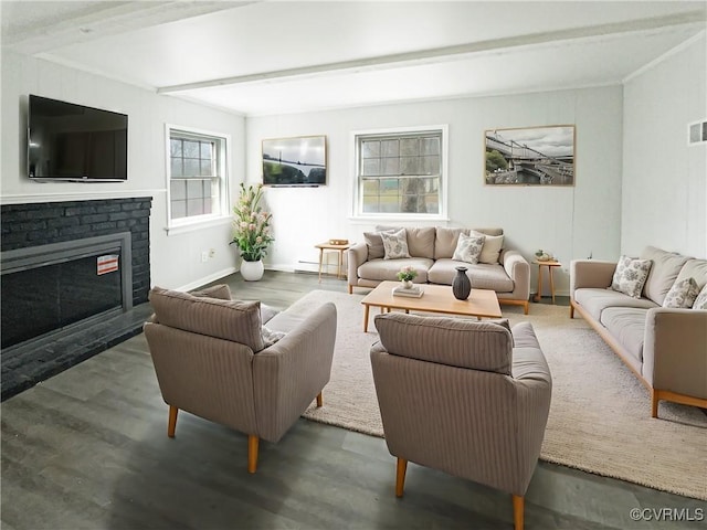 living room featuring visible vents, baseboards, beam ceiling, a fireplace, and wood finished floors