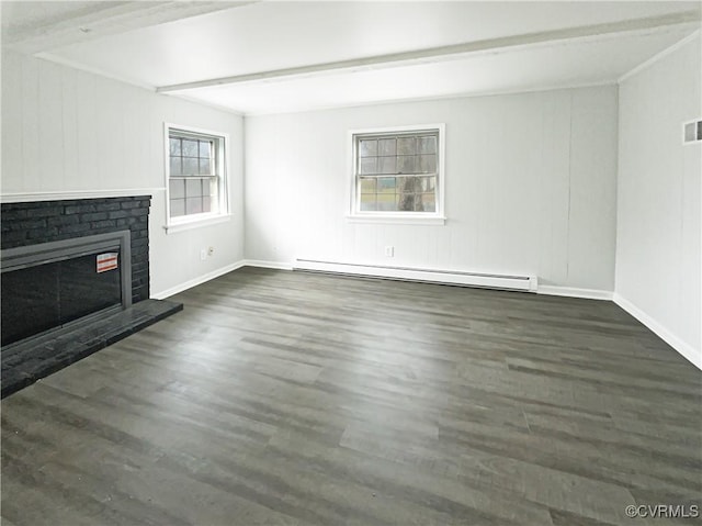 unfurnished living room featuring visible vents, a fireplace, a baseboard heating unit, and wood finished floors