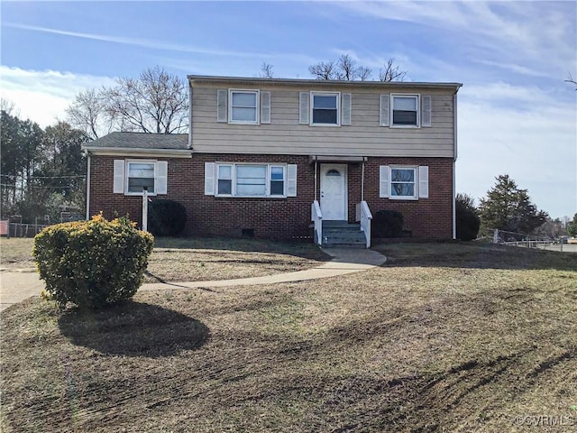 view of front of home with crawl space and brick siding