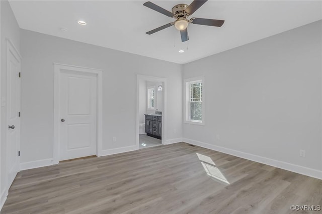 unfurnished bedroom with recessed lighting, baseboards, and light wood finished floors